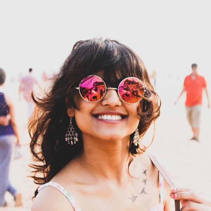 Kaveri Mehta, Lead Design Curator at Silver Line Labs, reviewing corporate floral arrangements